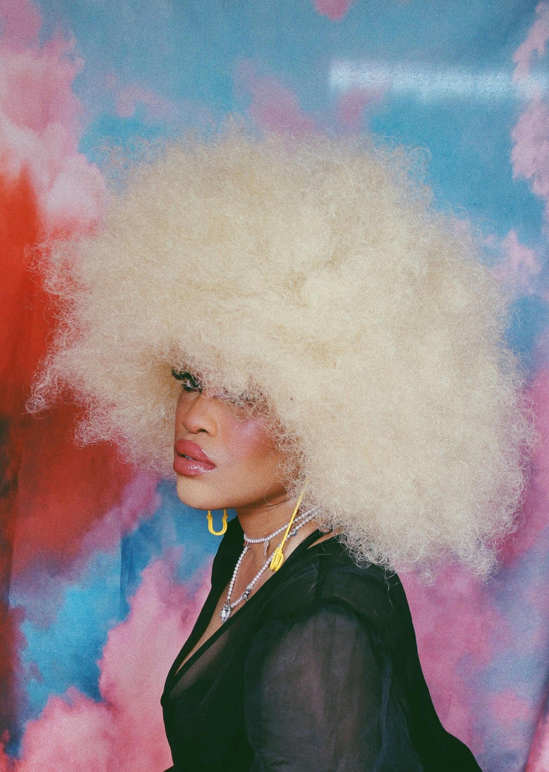 Editorial: pink feather topper against a disco tinsel backdrop