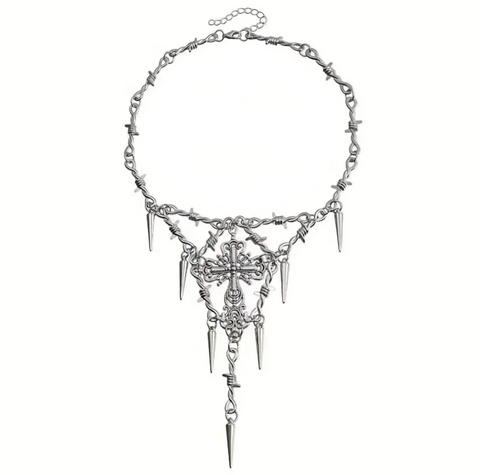 Silver necklace with spikes and cross pendant on a white background