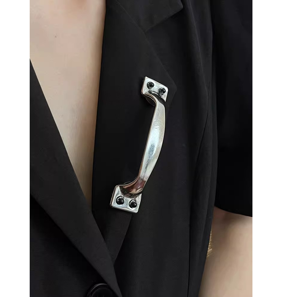 Metallic handle on a black garment