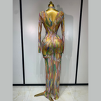 Colorful dress on a mannequin against a plain background