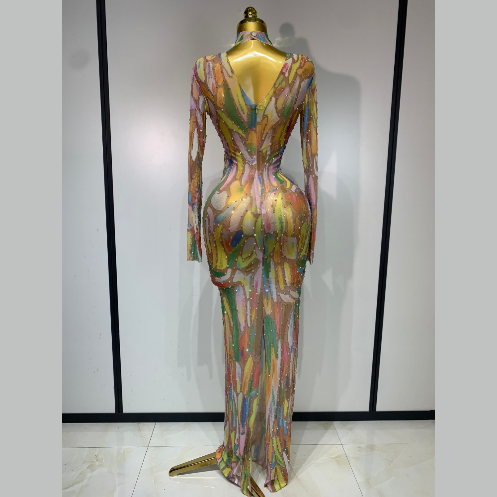Colorful dress on a mannequin against a plain background